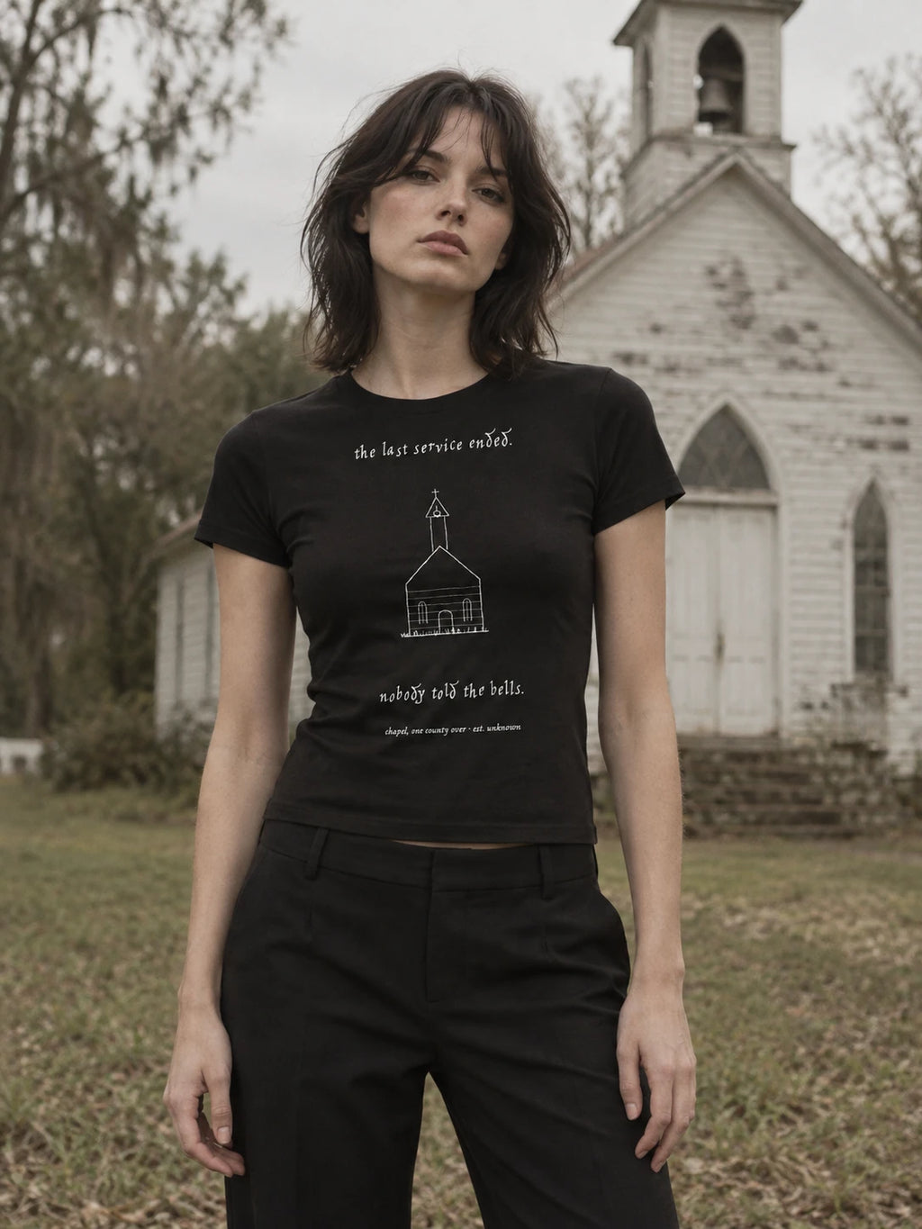 campaign portrait — the chapel baby tee, worn into the record (AI-styled imagery; product photographs follow)